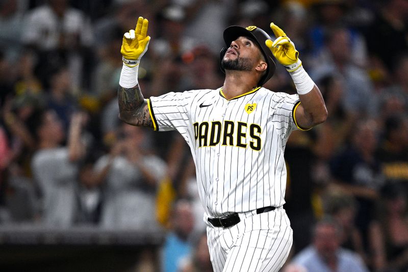 Aug 13, 2024; San Diego, California, USA; San Diego Padres right fielder David Peralta (24) celebrates after hitting a home run against the Pittsburgh Pirates during the fifth inning at Petco Park. Mandatory Credit: Orlando Ramirez-USA TODAY Sports