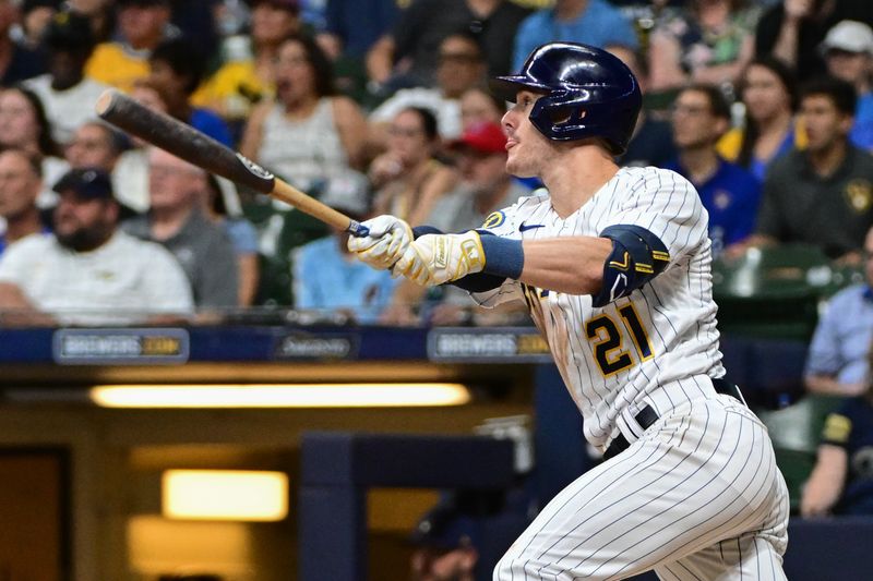 Sep 2, 2023; Milwaukee, Wisconsin, USA;  Milwaukee Brewers left fielder Mark Canha (21) hits a double to drive in a run against the Philadelphia Phillies in the fifth inning at American Family Field. Mandatory Credit: Benny Sieu-USA TODAY Sports