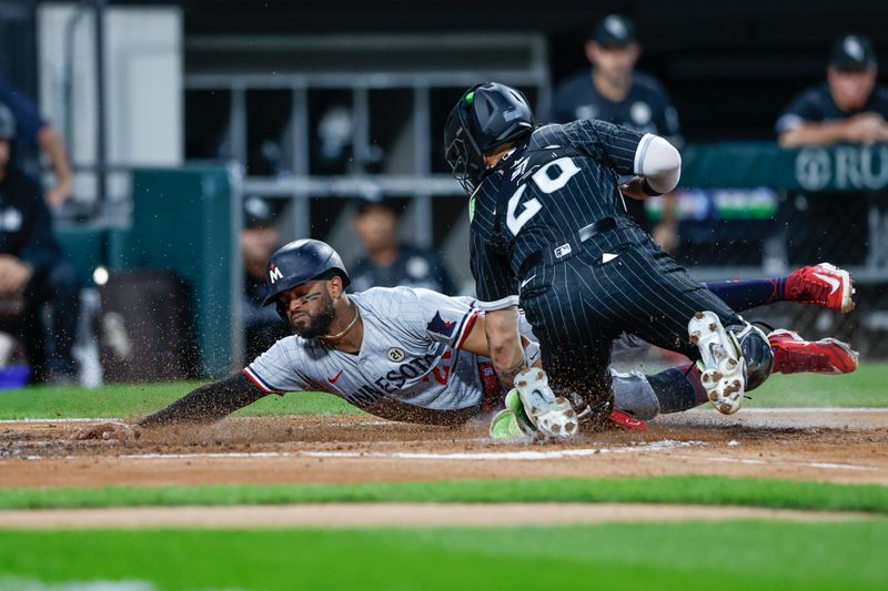 Sep 15, 2023; Chicago, Illinois, USA; Chicago White Sox catcher Korey Lee (26) tags out Minnesota Twins left fielder Willi Castro (21) at home plate during the second inning at Guaranteed Rate Field. Mandatory Credit: Kamil Krzaczynski-USA TODAY Sports