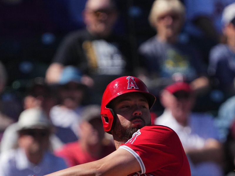 Mar 4, 2024; Surprise, Arizona, USA; Los Angeles Angels first baseman Nolan Schanuel (18) bats against the Texas Rangers during the third inning at Surprise Stadium. Mandatory Credit: Joe Camporeale-USA TODAY Sports