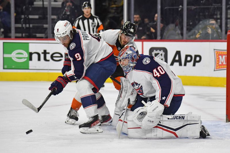 Jan 4, 2024; Philadelphia, Pennsylvania, USA;  Columbus Blue Jackets defenseman Ivan Provorov (9) picks up loose after goaltender Daniil Tarasov (40) made a save against Philadelphia Flyers left wing Joel Farabee (86) during the first period at Wells Fargo Center. Mandatory Credit: Eric Hartline-USA TODAY Sports