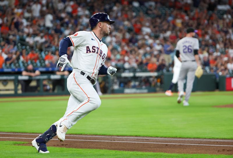 Jun 25, 2024; Houston, Texas, USA; Houston Astros third baseman Alex Bregman (2) hits a RBI single against Colorado Rockies starting pitcher Austin Gomber (26)  in the first inning at Minute Maid Park. Mandatory Credit: Thomas Shea-USA TODAY Sports