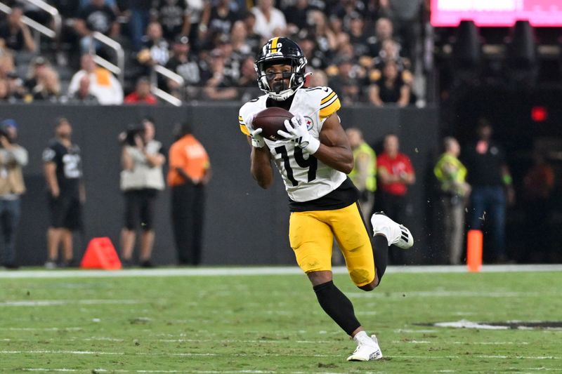 Pittsburgh Steelers wide receiver Calvin Austin III (19) makes a touchdown catch during the first half of an NFL football game against the Las Vegas Raiders Sunday, Sept. 24, 2023, in Las Vegas. (AP Photo/David Becker)