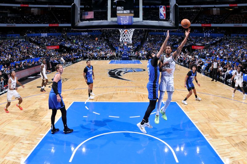 ORLANDO, FL - OCTOBER 25: Nicolas Claxton #33 of the Brooklyn Nets shoots the ball during the game against the Orlando Magic on October 25, 2024 at Kia Center in Orlando, Florida. NOTE TO USER: User expressly acknowledges and agrees that, by downloading and or using this photograph, User is consenting to the terms and conditions of the Getty Images License Agreement. Mandatory Copyright Notice: Copyright 2024 NBAE (Photo by Fernando Medina/NBAE via Getty Images)