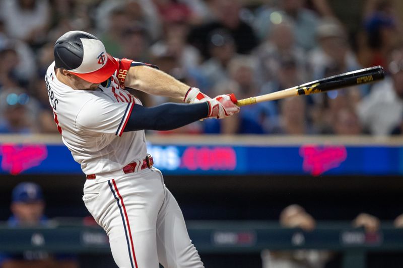 Aug 24, 2023; Minneapolis, Minnesota, USA; Minnesota Twins catcher Ryan Jeffers (27) hits a two run home run against the Texas Rangers in the eighth inning at Target Field. Mandatory Credit: Jesse Johnson-USA TODAY Sports