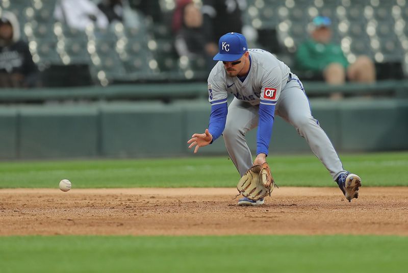 Apr 17, 2024; Chicago, Illinois, USA; Kansas City Royals third base Nick Loftin (12) fields the ball in the first inning during game two of a double header against the Chicago White Sox at Guaranteed Rate Field. Mandatory Credit: Melissa Tamez-USA TODAY Sports