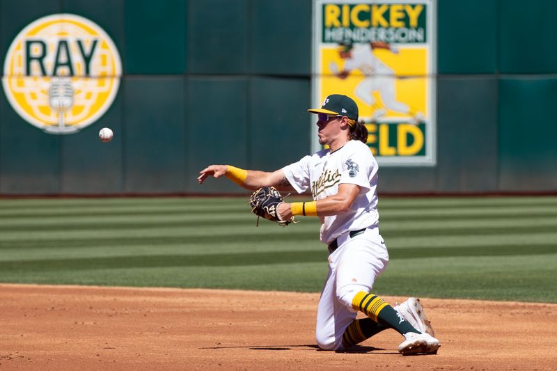 Sep 8, 2024; Oakland, California, USA; Oakland Athletics first baseman Tristan Gray (16) throws out Detroit Tigers second baseman Colt Keith from his knees during the third inning at Oakland-Alameda County Coliseum. Mandatory Credit: D. Ross Cameron-Imagn Images