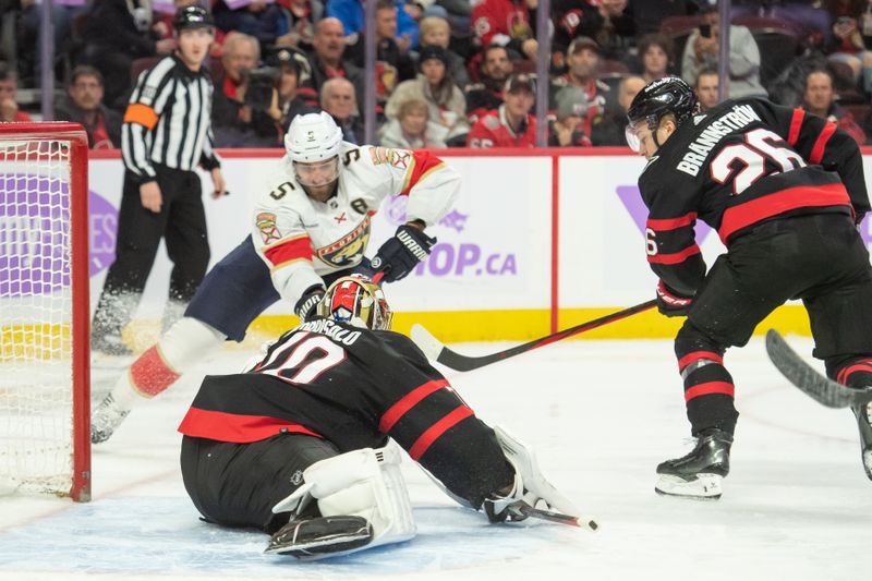 Nov 27, 2023; Ottawa, Ontario, CAN; Ottawa Senators goalie Joonas Korpisalo (70) makes a save on a shot from Florida Panthers defenseman Aaron Ekblad (5) in the second period at the Canadian Tire Centre. Mandatory Credit: Marc DesRosiers-USA TODAY Sports