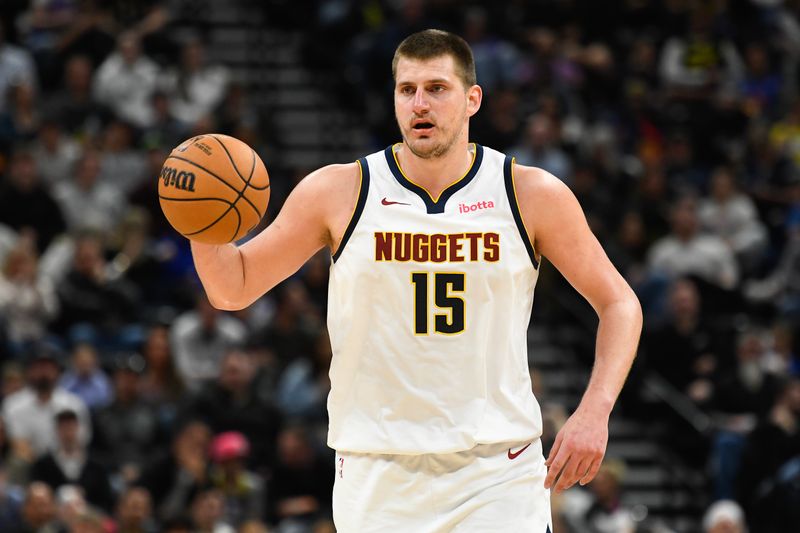 SALT LAKE CITY, UTAH - APRIL 09: Nikola Jokic #15 of the Denver Nuggets brings the ball up court in the second half against the Utah Jazz at Delta Center on April 09, 2024 in Salt Lake City, Utah. NOTE TO USER: User expressly acknowledges and agrees that, by downloading and or using this photograph, User is consenting to the terms and conditions of the Getty Images License Agreement.  (Photo by Alex Goodlett/Getty Images)