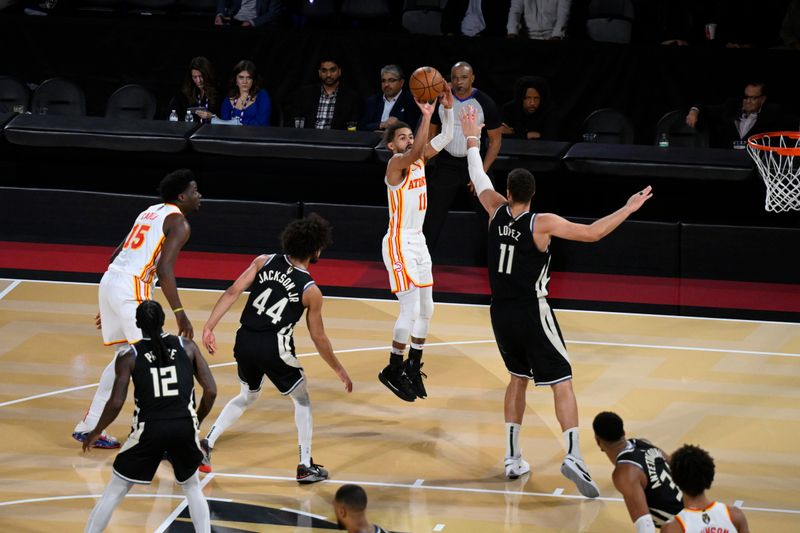 LAS VEGAS, NV - DECEMBER 14: Trae Young #11 of the Atlanta Hawks shoots the ball during the game against the Milwaukee Bucks during the Emirates NBA Cup Semifinal game on December 14, 2024 at T-Mobile Arena in Las Vegas, Nevada. NOTE TO USER: User expressly acknowledges and agrees that, by downloading and/or using this Photograph, user is consenting to the terms and conditions of the Getty Images License Agreement. Mandatory Copyright Notice: Copyright 2024 NBAE (Photo by David Dow/NBAE via Getty Images)