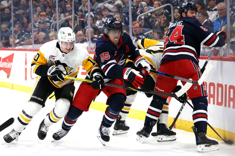 Oct 20, 2024; Winnipeg, Manitoba, CAN; Pittsburgh Penguins left wing Drew O'Connor (10) and Winnipeg Jets center Mark Scheifele (55) chase after the puck in the first period at Canada Life Centre. Mandatory Credit: James Carey Lauder-Imagn Images