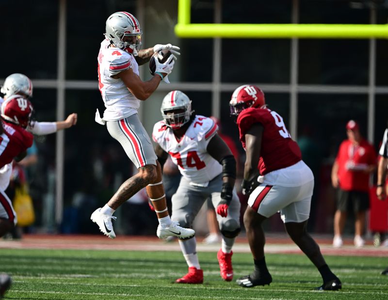 Sep 2, 2023; Bloomington, Indiana, USA; Ohio State Buckeyes wide receiver Julian Fleming (4) catches a pass during the second half of the game against the Indiana Hoosiers at Memorial Stadium. Mandatory Credit: Marc Lebryk-USA TODAY Sports