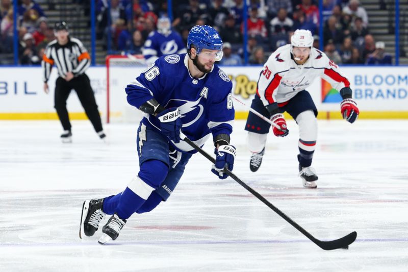 Feb 22, 2024; Tampa, Florida, USA;  Tampa Bay Lightning right wing Nikita Kucherov (86) controls the puck against the Washington Capitals in the third period at Amalie Arena. Mandatory Credit: Nathan Ray Seebeck-USA TODAY Sports