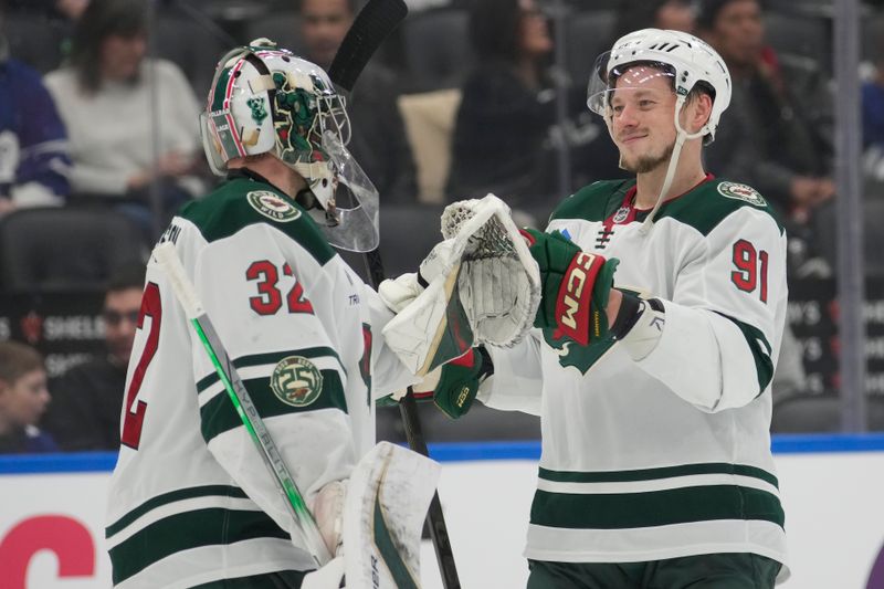 Jan 19, 2026; Toronto, Ontario, CAN; Minnesota Wild forward Vladimir Tarasenko (91) celebrates with goaltender Filip Gustavsson (32) after defeating the Toronto Maple Leafs in the third period at Scotiabank Arena. Mandatory Credit: John E. Sokolowski-Imagn Images Jan 19, 2026; Toronto, Ontario, CAN; Minnesota Wild forward Vladimir Tarasenko (91) celebrates with goaltender Filip Gustavsson (32) after defeating the Toronto Maple Leafs in the third period at Scotiabank Arena. Mandatory Credit: John E. Sokolowski-Imagn Images