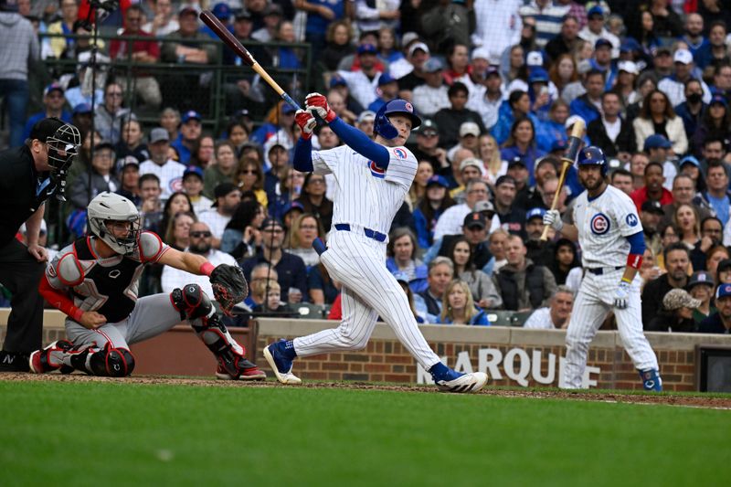 Sep 28, 2024; Chicago, Illinois, USA;  Chicago Cubs outfielder Pete Crow-Armstrong (52) hits an RBI single during the eighth inning against the Cincinnati Reds at Wrigley Field. Mandatory Credit: Matt Marton-Imagn Images