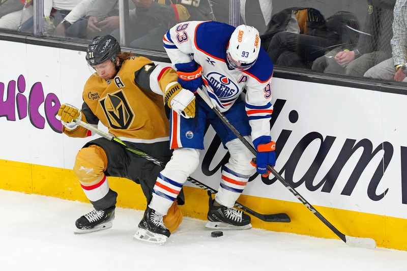 Apr 1, 2025; Las Vegas, Nevada, USA; Edmonton Oilers center Ryan Nugent-Hopkins (93) steals the puck from Vegas Golden Knights center William Karlsson (71) during the third period at T-Mobile Arena. Mandatory Credit: Stephen R. Sylvanie-Imagn Images