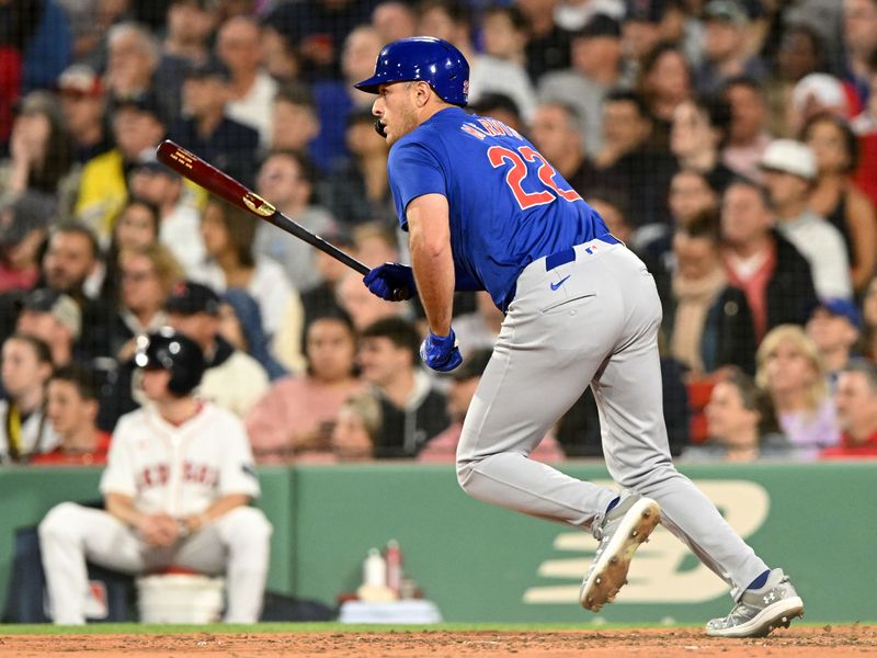 Apr 28, 2024; Boston, Massachusetts, USA; Chicago Cubs first baseman Matt Mervis (22) hits a RBI single against the Boston Red Sox during the seventh inning at Fenway Park. Mandatory Credit: Brian Fluharty-USA TODAY Sports