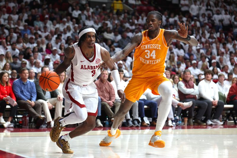 Jan 24, 2026; Tuscaloosa, Alabama, USA; Alabama Crimson Tide guard Latrell Wrightsell Jr. (3) drives to the basket against Tennessee Volunteers forward Felix Okpara (34) during the second half at Coleman Coliseum. Mandatory Credit: David Leong-Imagn Images