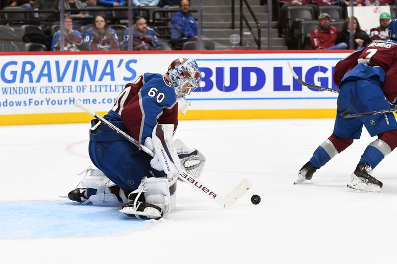 Sep 29, 2024; Denver, Colorado, USA; Colorado Avalanche goaltender Justus Annunen (60) makes a save during the first period against the Utah Hockey Club at Ball Arena. Mandatory Credit: Christopher Hanewinckel-Imagn Images