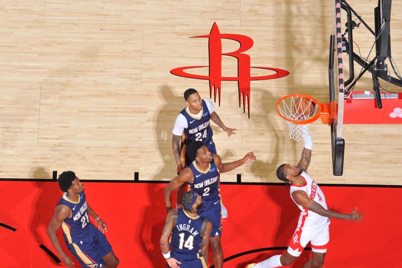 HOUSTON, TX - OCTOBER 15: Jalen Green #4 of the Houston Rockets dunks the ball during the game against the New Orleans Pelicans during a NBA preseason game on October 15, 2024 at the Toyota Center in Houston, Texas. NOTE TO USER: User expressly acknowledges and agrees that, by downloading and or using this photograph, User is consenting to the terms and conditions of the Getty Images License Agreement. Mandatory Copyright Notice: Copyright 2024 NBAE (Photo by Logan Riely/NBAE via Getty Images)