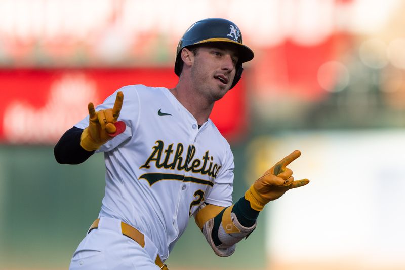 Jul 23, 2024; Oakland, California, USA;  Oakland Athletics outfielder Brent Rooker (25) reacts to the dugout after hitting a two-run home run during the first inning against the Houston Astros at Oakland-Alameda County Coliseum. Mandatory Credit: Stan Szeto-USA TODAY Sports