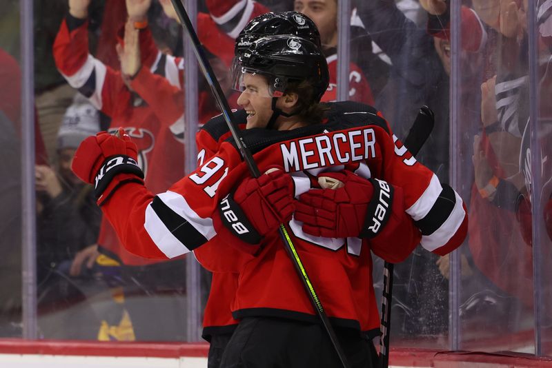 Feb 23, 2023; Newark, New Jersey, USA; New Jersey Devils center Dawson Mercer (91) celebrates his game winning goal against the Los Angeles Kings during overtime at Prudential Center. Mandatory Credit: Ed Mulholland-USA TODAY Sports