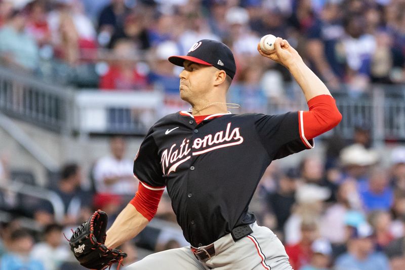 Aug 23, 2024; Cumberland, Georgia, USA; Washington Nationals pitcher MacKenzie Gore (1) pitches the ball against the Atlanta Braves during the third inning at Truist Park. Mandatory Credit: Jordan Godfree-USA TODAY Sports