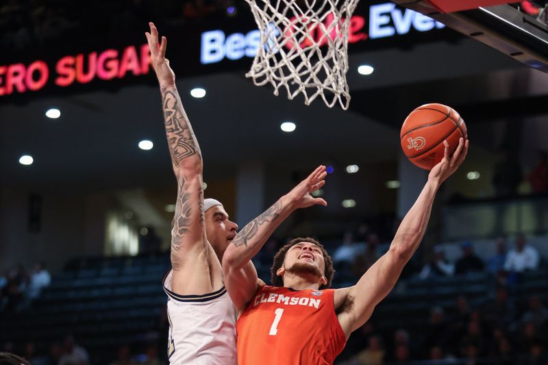 Jan 14, 2025; Atlanta, Georgia, USA; Clemson Tigers guard Chase Hunter (1) shoot the ball against Georgia Tech Yellow Jackets forward Duncan Powell (31) during the second half at McCamish Pavilion. Mandatory Credit: Jordan Godfree-Imagn Images