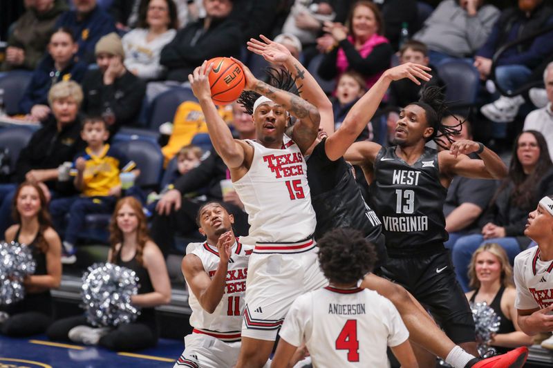 Feb 8, 2026; Morgantown, West Virginia, USA; Texas Tech Red Raiders forward JT Toppin (15) grabs a rebound during the first half against the West Virginia Mountaineers at Hope Coliseum. Mandatory Credit: Ben Queen-Imagn Images
