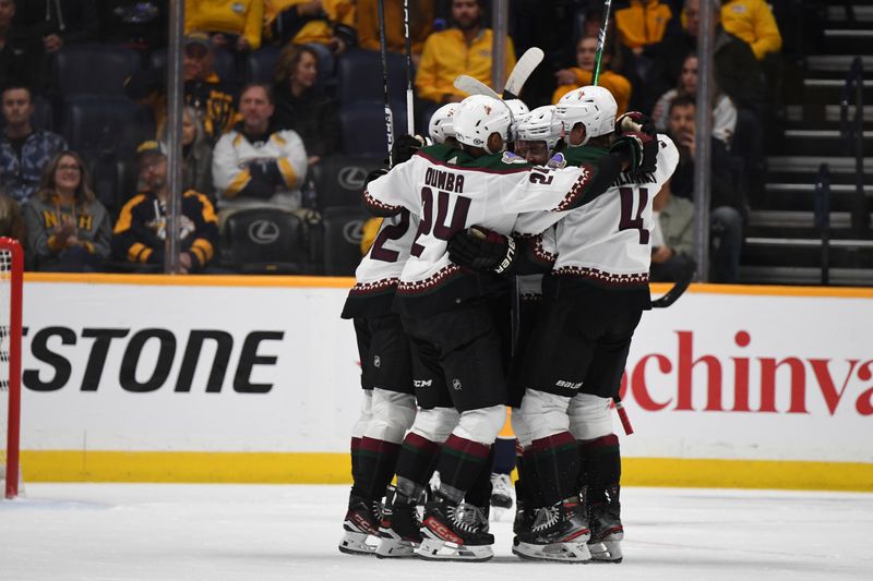 Nov 11, 2023; Nashville, Tennessee, USA; Arizona Coyotes players celebrate after a goal by left wing Michael Carcone (53) during the first period against the Nashville Predators at Bridgestone Arena. Mandatory Credit: Christopher Hanewinckel-USA TODAY Sports