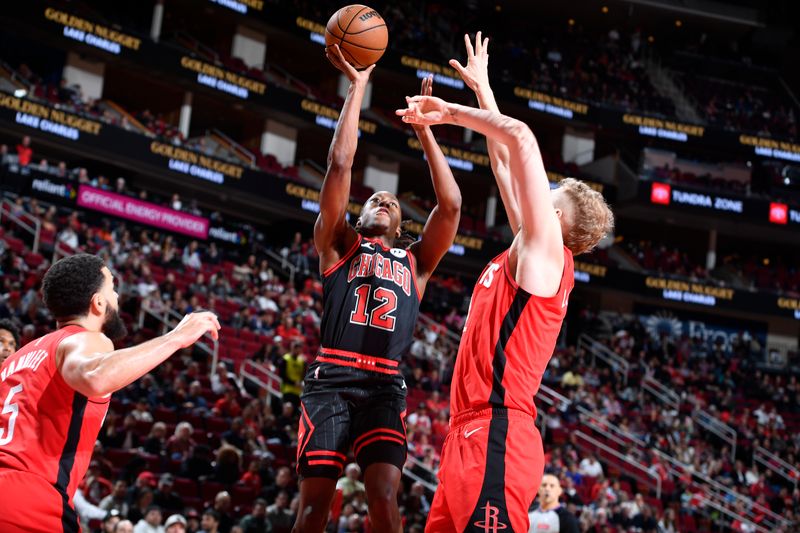 HOUSTON, TX - MARCH 21:   Ayo Dosunmu #12 of the Chicago Bulls shoots the ball during the game against the Houston Rockets on March 21, 2024 at the Toyota Center in Houston, Texas. NOTE TO USER: User expressly acknowledges and agrees that, by downloading and or using this photograph, User is consenting to the terms and conditions of the Getty Images License Agreement. Mandatory Copyright Notice: Copyright 2024 NBAE (Photo by Logan Riely/NBAE via Getty Images)