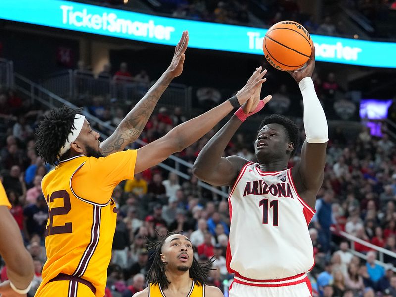 Mar 10, 2023; Las Vegas, NV, USA; Arizona Wildcats center Oumar Ballo (11) looks to shoot against Arizona State Sun Devils forward Warren Washington (22) during the second half at T-Mobile Arena. Mandatory Credit: Stephen R. Sylvanie-USA TODAY Sports