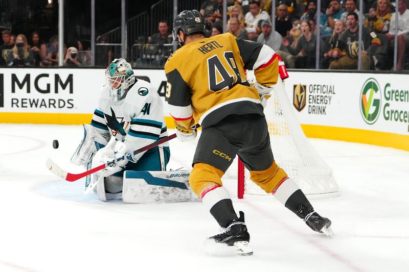 Oct 26, 2024; Las Vegas, Nevada, USA; San Jose Sharks goaltender Vitek Vanecek (41) makes a save as Vegas Golden Knights center Tomas Hertl (48) looks for a rebound during the second period at T-Mobile Arena. Mandatory Credit: Stephen R. Sylvanie-Imagn Images