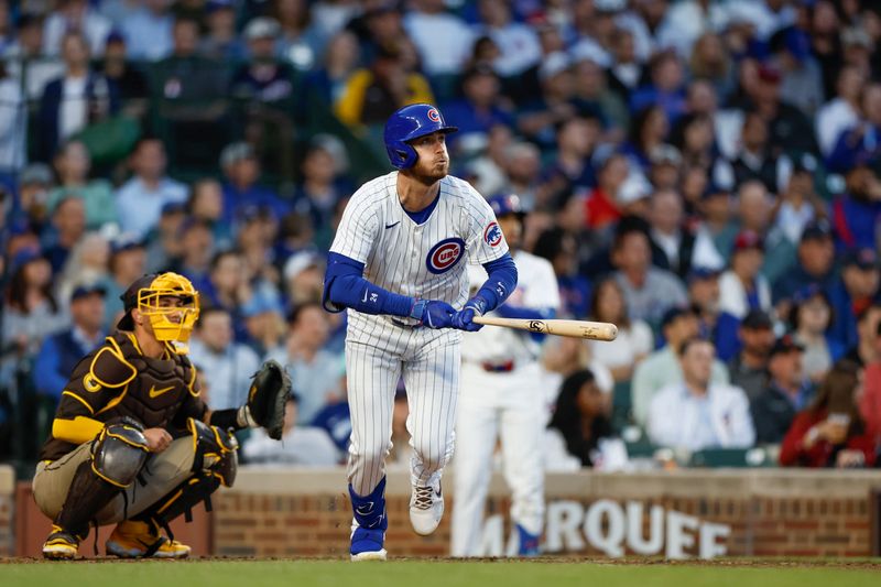 May 7, 2024; Chicago, Illinois, USA; Chicago Cubs outfielder Cody Bellinger (24) watches his solo home run against the San Diego Padres during the fourth inning at Wrigley Field. Mandatory Credit: Kamil Krzaczynski-USA TODAY Sports