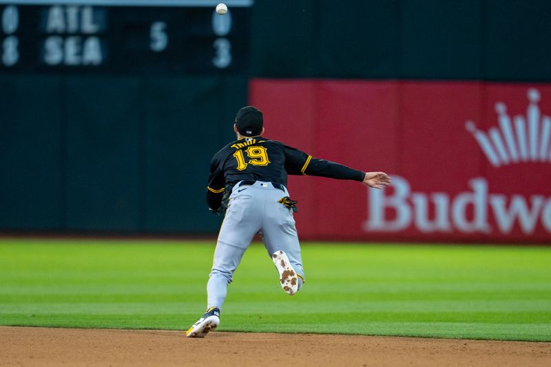 Apr 30, 2024; Oakland, California, USA;  Pittsburgh Pirates second baseman Jared Triolo (19) fielded the deflection for an out against the Oakland Athletics during the fourth inning  at Oakland-Alameda County Coliseum. Mandatory Credit: Neville E. Guard-USA TODAY Sports