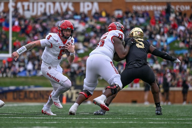 Nov 11, 2023; Winston-Salem, North Carolina, USA; North Carolina State Wolfpack quarterback Brennan Armstrong (5) runs against the Wake Forest Demon Deacons during the first half at Allegacy Federal Credit Union Stadium. Mandatory Credit: William Howard-USA TODAY Sports