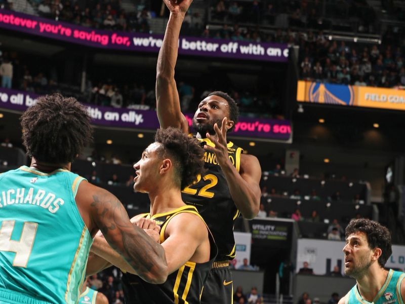 CHARLOTTE, NC - MARCH 29: Andrew Wiggins #22 of the Golden State Warriors drives to the basket during the game against the Charlotte Hornets on March 29, 2024 at Spectrum Center in Charlotte, North Carolina. NOTE TO USER: User expressly acknowledges and agrees that, by downloading and or using this photograph, User is consenting to the terms and conditions of the Getty Images License Agreement. Mandatory Copyright Notice: Copyright 2024 NBAE (Photo by Kent Smith/NBAE via Getty Images)