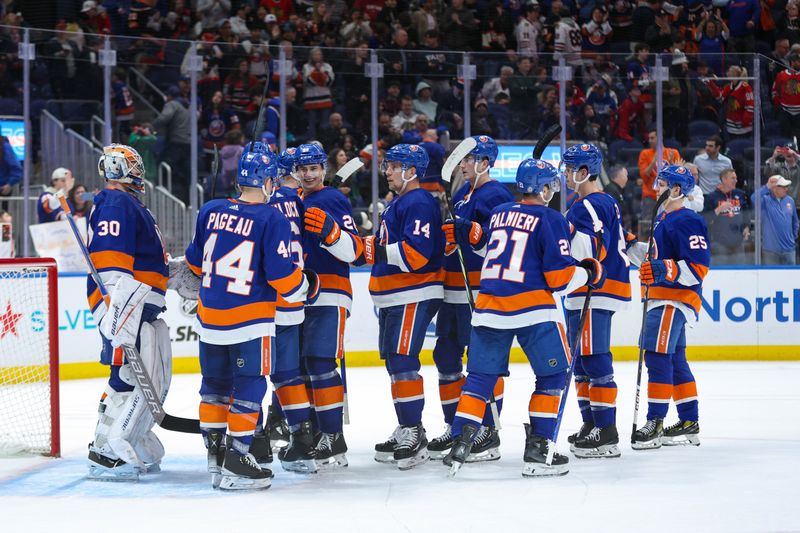 Apr 2, 2024; Elmont, New York, USA; New York Islanders celebrate their victory over the Chicago Blackhawks at UBS Arena. Mandatory Credit: Thomas Salus-USA TODAY Sports