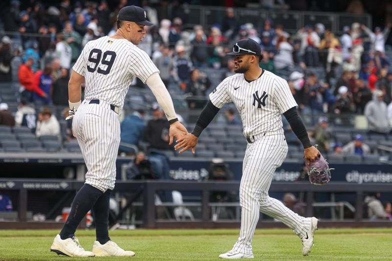 May 22, 2025; Bronx, New York, USA; New York Yankees designated hitter Aaron Judge (99) celebrates with left fielder Jasson Dominguez (24) after defeating the Texas Rangers at Yankee Stadium. Mandatory Credit: Vincent Carchietta-Imagn Images