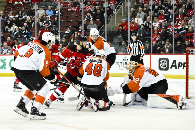 Jan 29, 2025; Newark, New Jersey, USA; Philadelphia Flyers goaltender Ivan Fedotov (82) makes a save against the New Jersey Devils during the third period at Prudential Center. Mandatory Credit: John Jones-Imagn Images