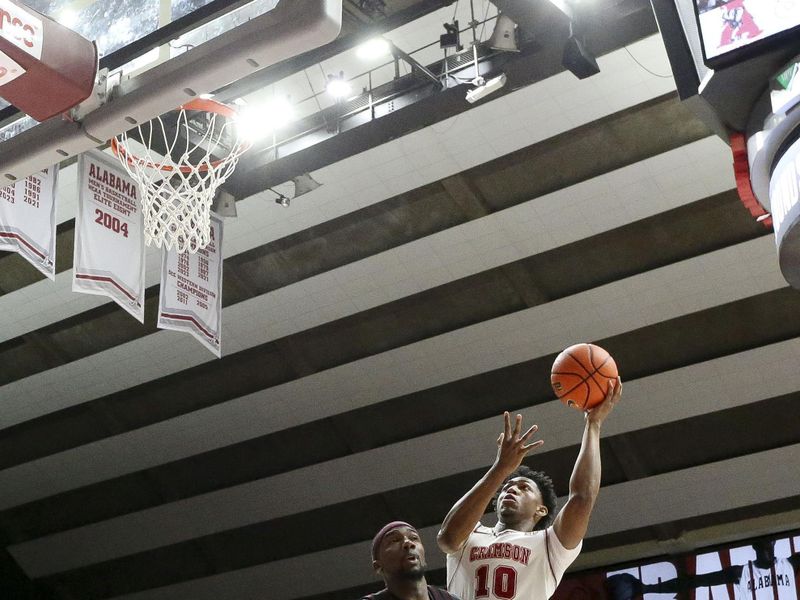 Feb 17, 2024; Tuscaloosa, Alabama, USA;  Alabama Crimson Tide forward Mouhamed Dioubate (10) shoots the ball against Texas A&M Aggies guard Tyrece Radford (23) during the second half at Coleman Coliseum. Alabama won 100-75. Mandatory Credit: Gary Cosby Jr.-USA TODAY Sports