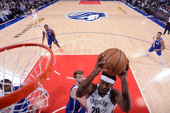 SACRAMENTO, CA - DECEMBER 11: Day'Ron Sharpe #20 of the Brooklyn Nets rebounds the ball during the game against the Sacramento Kings on December 11, 2023 at Golden 1 Center in Sacramento, California. NOTE TO USER: User expressly acknowledges and agrees that, by downloading and or using this Photograph, user is consenting to the terms and conditions of the Getty Images License Agreement. Mandatory Copyright Notice: Copyright 2023 NBAE (Photo by Rocky Widner/NBAE via Getty Images)