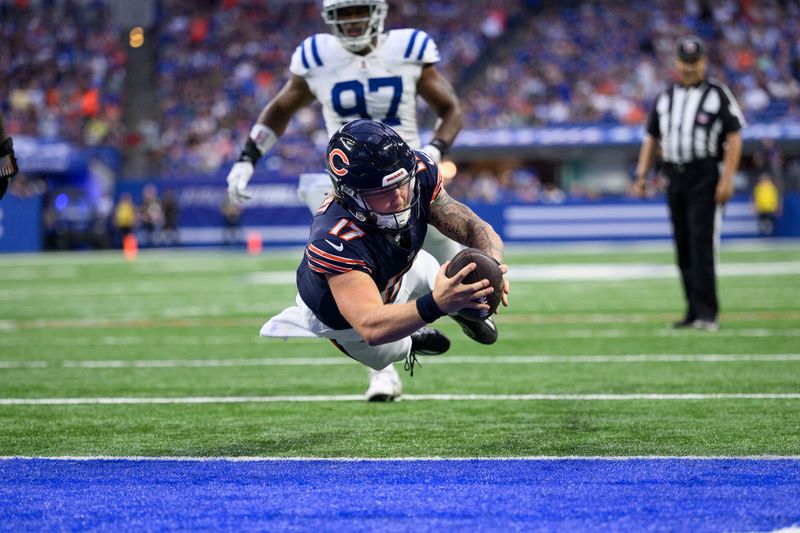 Chicago Bears quarterback Tyson Bagent (17) dives in for a touchdown during an NFL football game against the Indianapolis Colts, Saturday, Aug. 19, 2023, in Indianapolis. (AP Photo/Zach Bolinger)