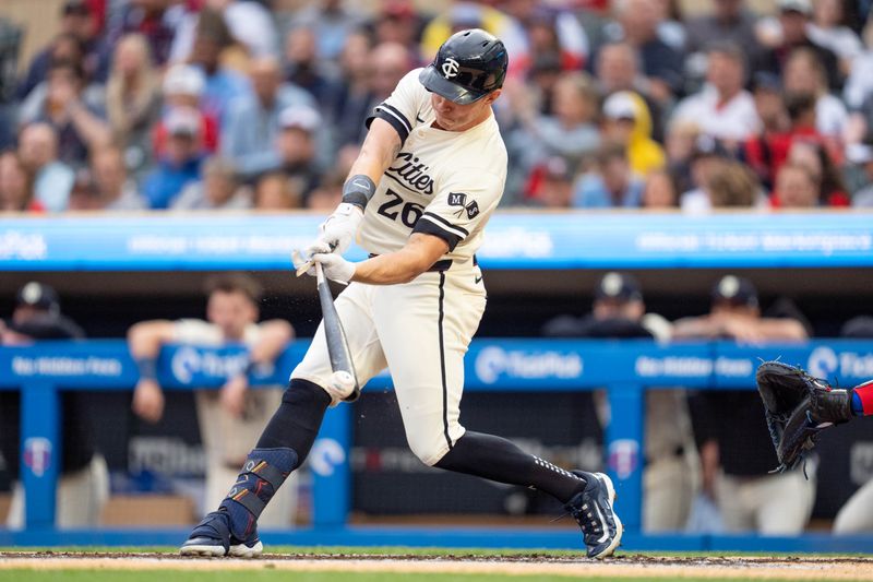 May 24, 2024; Minneapolis, Minnesota, USA; Minnesota Twins right fielder Max Kepler (26) breaks a bat against Texas Rangers pitcher Jose Urena (54) in the first inning at Target Field. Mandatory Credit: Matt Blewett-USA TODAY Sports