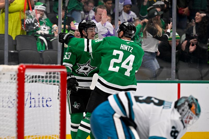 Nov 20, 2024; Dallas, Texas, USA; Dallas Stars center Wyatt Johnston (53) and center Roope Hintz (24) celebrates a goal scored by Johnston against the San Jose Sharks during the second period at the American Airlines Center. Mandatory Credit: Jerome Miron-Imagn Images