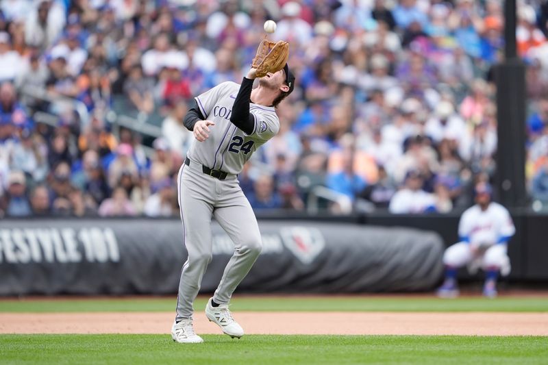 Jun 1, 2025; New York City, New York, USA; Colorado Rockies third baseman Ryan McMahon (24) catches a fly ball hit by New York Mets shortstop Francisco Lindor (12) (not pictured) during the seventh inning at Citi Field. Mandatory Credit: Gregory Fisher-Imagn Images