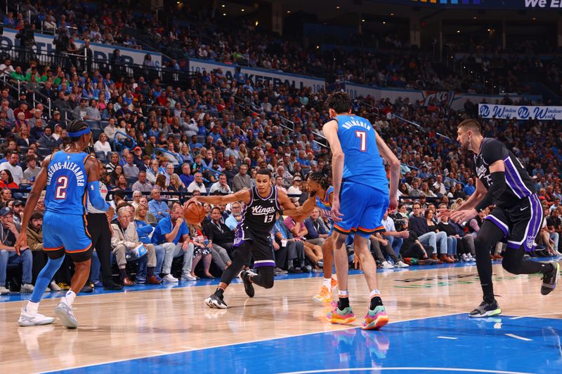 OKLAHOMA CITY, OK - APRIL 9: Keegan Murray #13 of the Sacramento Kings dribbles the ball during the game against the Oklahoma City Thunder  on April 9, 2024 at Paycom Arena in Oklahoma City, Oklahoma. NOTE TO USER: User expressly acknowledges and agrees that, by downloading and or using this photograph, User is consenting to the terms and conditions of the Getty Images License Agreement. Mandatory Copyright Notice: Copyright 2024 NBAE (Photo by Zach Beeker/NBAE via Getty Images)