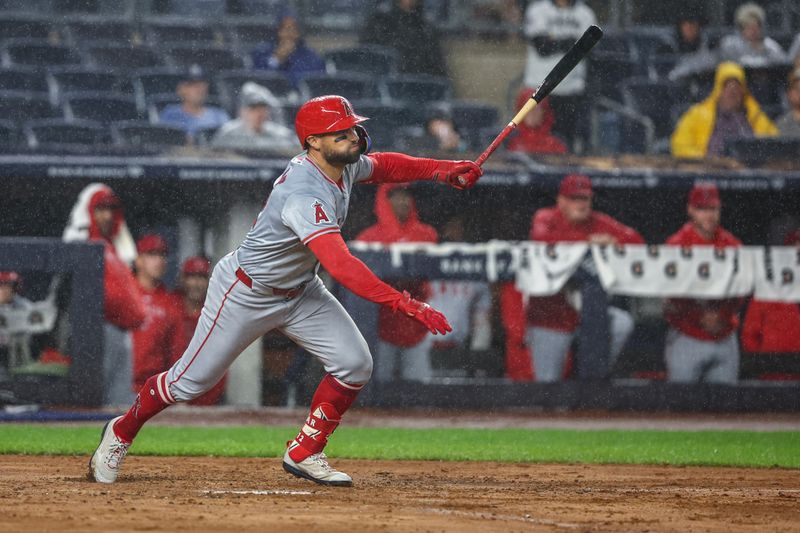 Aug 8, 2024; Bronx, New York, USA;  Los Angeles Angels left fielder Kevin Pillar (12) hits a two run single in the fifth inning against the New York Yankees at Yankee Stadium. Mandatory Credit: Wendell Cruz-USA TODAY Sports