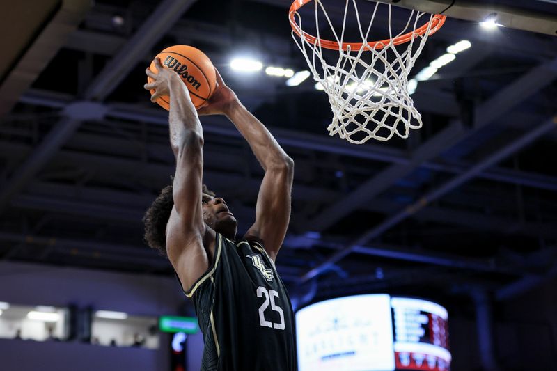 Feb 4, 2023; Cincinnati, Ohio, USA;  UCF Knights forward Taylor Hendricks (25) dunks the ball against the Cincinnati Bearcats in the second half at Fifth Third Arena. Mandatory Credit: Aaron Doster-USA TODAY Sports