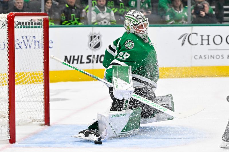 Jan 25, 2024; Dallas, Texas, USA; Dallas Stars goaltender Jake Oettinger (29) makes a save on a Anaheim Ducks shot during the first period at the American Airlines Center. Mandatory Credit: Jerome Miron-USA TODAY Sports